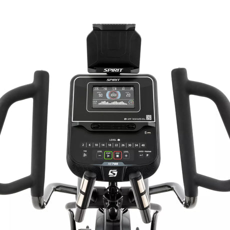Close-up of a Spirit exercise bike console with digital display on a white background