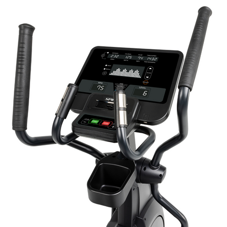 Close-up of a elliptical machine with a digital display on a white background