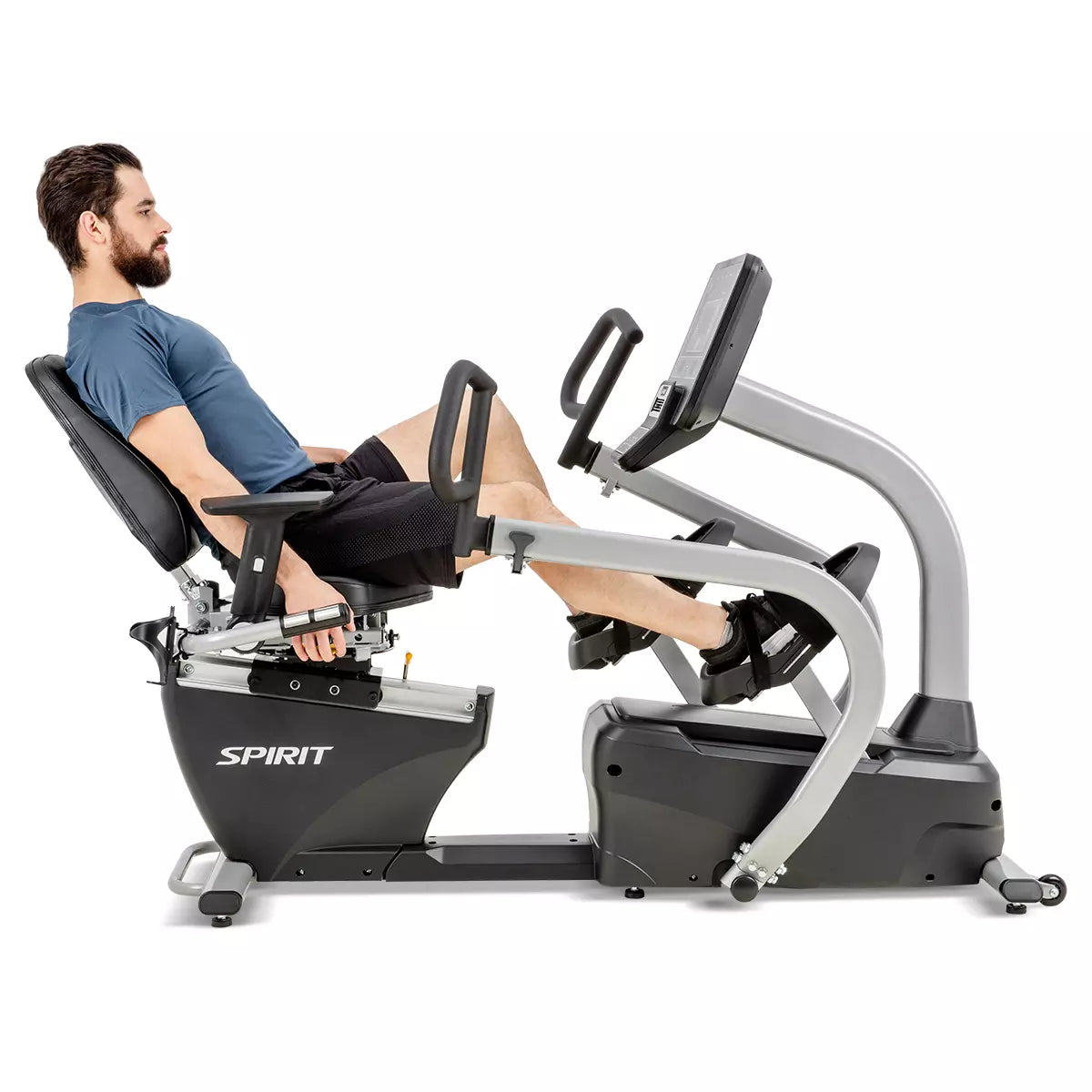Man using a Spirit exercise bike on a white background