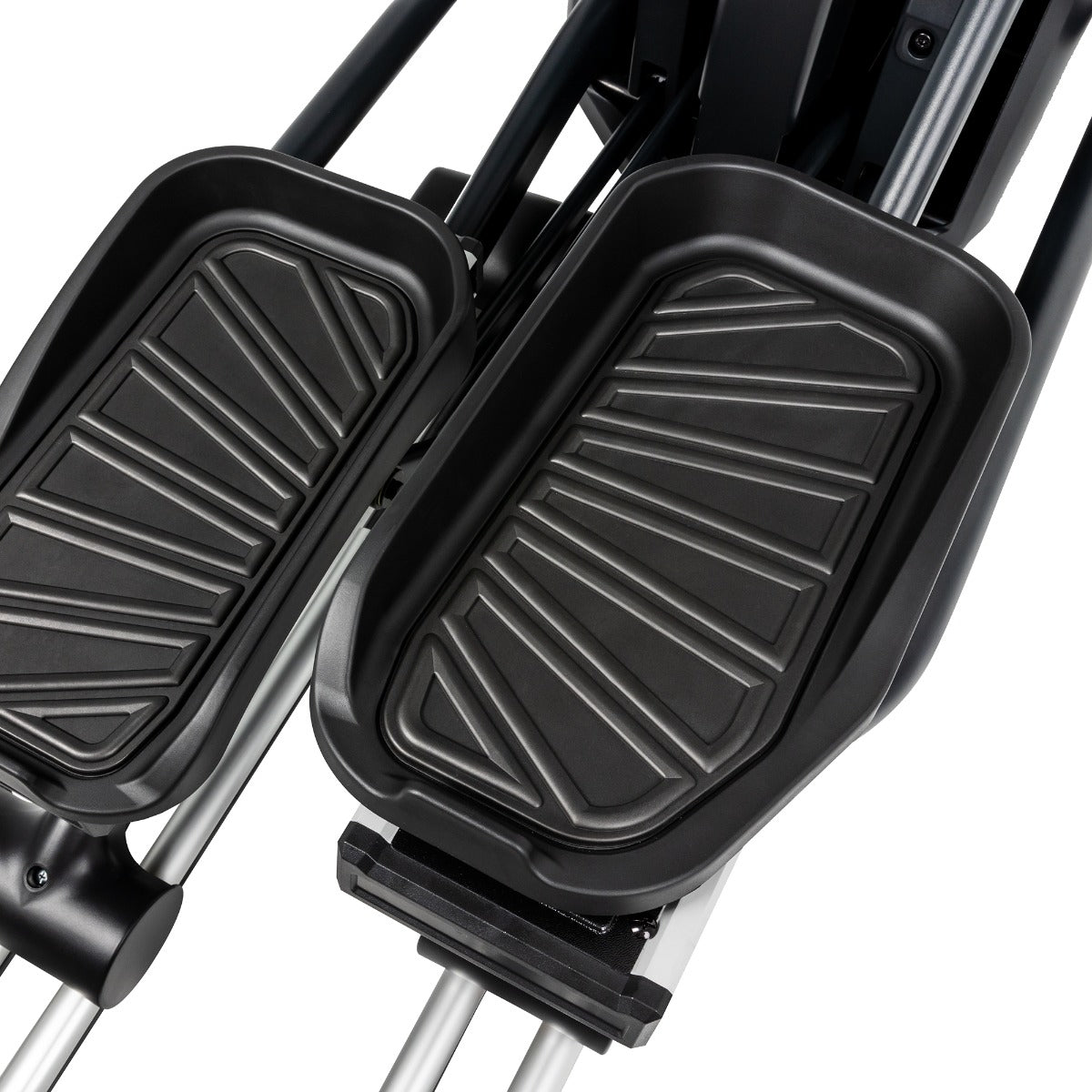 Black foot pedals on a stair climber machine