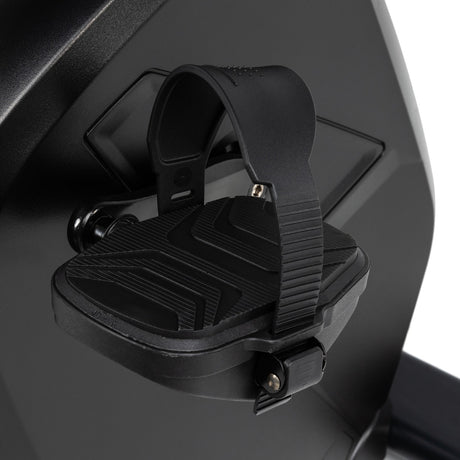 Close-up of a black footrest on a vehicle, likely a motorcycle or scooter.