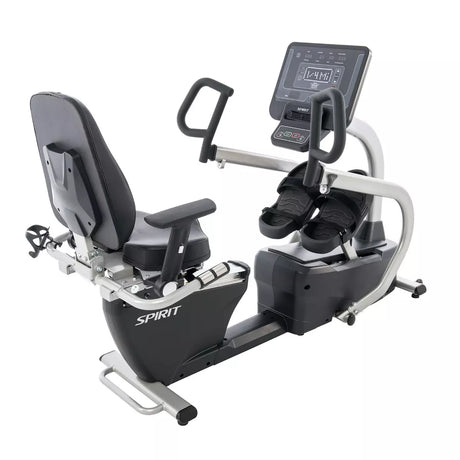 Recumbent exercise bike with digital display on a white background