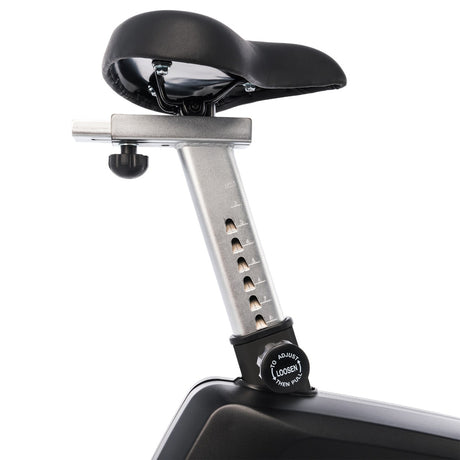 Bicycle seat post with adjustable mechanism on a white background