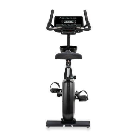Black exercise bike with digital display on a white background