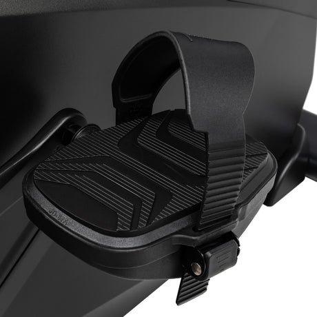 Black bike foot peg on a motorcycle with a white background