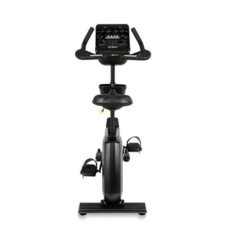 Black exercise bike with digital display on a white background