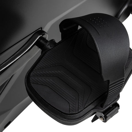 Close-up of a black motorcycle seat with a textured design on a white background