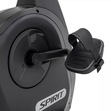 Close-up of a black exercise bike with a Spirit brand logo on a white background