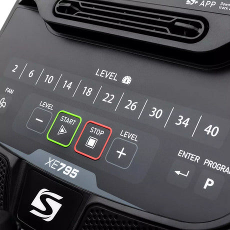Control panel of a device with labeled buttons and display for settings.
